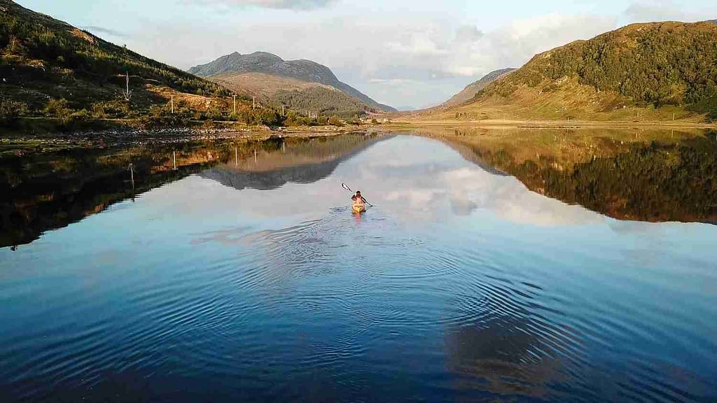 Kayaker on Loch Sunart Sea kayaker alone on Loch Sunart